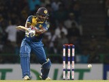 Sri Lankan cricketer Kusal Perera plays a shot during the first Twenty20 International cricket match between Sri Lanka and the West Indies at the Pallekele International Cricket Stadium in Pallekele on November 9, 2015