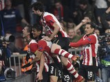 PSV Eindhoven's Dutch forward Luuk De Jong (L) celebrates with his teammates after scoring during the UEFA Champions League, Group B, football match PSV Eindhoven vs FK CSKA Moscow at the Philips Stadion stadium in Eindhoven on December 8, 2015.