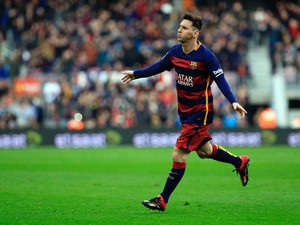 FC Barcelona's Argentinian forward Lionel Messi celebrates a goal during the Spanish league football match FC Barcelona vs RC Deportivo La Coruna at the Camp Nou stadium in Barcelona on December 12, 2015
