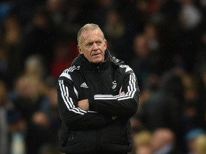 Alan Curtis caretaker Manager of Swansea City looks on during the Barclays Premier League match between Manchester City and Swansea City at Etihad Stadium on December 12, 2015
