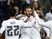 Real Madrid's French forward Karim Benzema (C) celebrates with teammates after scoring during the UEFA Champions League Group A football match Real Madrid CF vs Malmo FF at the Santiago Bernabeu stadium in Madrid on December 8, 2015. 