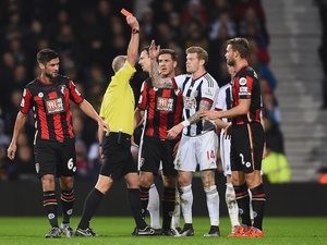 James McClean of West Brom is shown the red card by referee Mike Dean during the game with Bournemouth on December 19, 2015