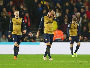 Arsenal teammates Aaron Ramsey, Olivier Giroud and Nacho Monreal react after Southampton score their first on December 26, 2015
