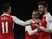 Olivier Giroud celebrates with Arsenal teammates Mesut Ozil and Theo Walcott after scoring against Manchester City in the Premier League on December 21, 2015