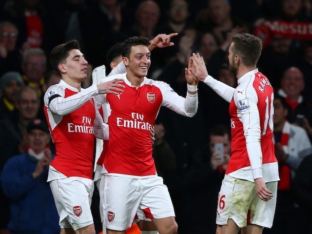 Mesut Ozil celebrates scoring his side's second during the game between Arsenal and Bournemouth on December 28, 2015