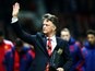 Louis van Gaal acknowledges the home crowd prior to the game between Manchester United and Chelsea on December 28, 2015