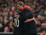 Philippe Coutinho receives a hug from manager Jurgen Klopp after coming off during the League Cup semi-final between Stoke and Liverpool on January 5, 2016