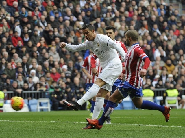 Real Madrid's Cristiano Ronaldo kicks to score against Sporting Gijon on January 17, 2016