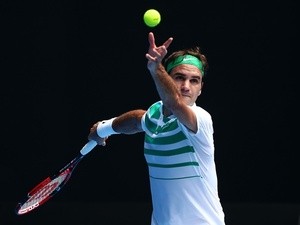 Roger Federer serves in his second-round match against Alexandr Dolgopolov during day three of the 2016 Australian Open on January 20, 2016
