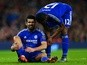 Diego Costa sits on the turf injured before being substituted during the Premier League match between Arsenal and Chelsea on January 24, 2016