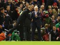 Jurgen Klopp and Mark Hughes shake hands during the League Cup match between Liverpool and Stoke City on January 26, 2016
