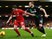 Jon Flanagan and Marko Arnautovic tussle for the ball during the League Cup semi-final second leg between Liverpool and Stoke City at Anfield