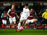 Joao Teixeira evades Mark Noble and Winston Reid during the FA Cup fourth-round replay between West Ham United and Liverpool  on February 9, 2016 