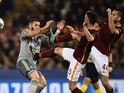 Miralem Pjanic and Konstas Manolas gang up on Karim Benzema during the Champions League match between AS Roma and Real Madrid on February 17, 2016