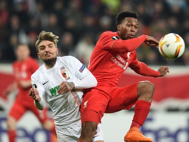 Konstantinos Stafylidis and Daniel Sturridge in action during the Europa League game between Augsburg and Liverpool on February 18, 2016