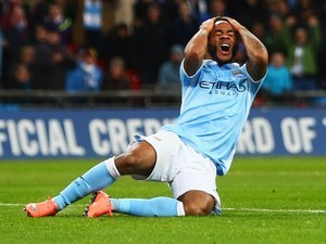 Raheem Sterling clutches his afro after missing a shot during the League Cup final between Liverpool and Manchester City on February 28, 2016