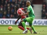 Sadio Mane controls the ball under pressure of Younes Kaboul during the Premier League match between Southampton and Sunderland at St Mary's Stadium on March 5, 2016