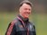Louis van Gaal smiles during a Manchester United training session on March 9, 2016