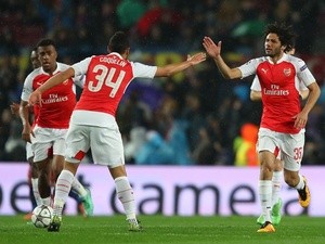 Mohamed Elneny celebrates scoring during the Champions League round-of-16 second leg between Barcelona and Arsenal on March 16, 2016