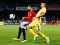 Gerard Pique of Spain battles for the ball with Dragos Grigore of Romania during the International Friendly match between Romania and Spain held at the Cluj Arena on March 27, 2016