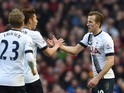 Harry Kane celebrates scoring during the Premier League match between Liverpool and Tottenham Hotspur on April 2, 2016