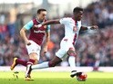 Wilfried Zaha and Mark Noble in action during the Premier League match between West Ham United and Crystal Palace on April 2, 2016