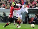 Oscar de Marcos tugs Carlos Bacca during the Europa League quarter-final between Athletic Bilbao and Sevilla on April 7, 2016