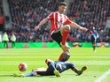Shane Long and Chancel Mbemba during the Premier League match between Southampton and Newcastle United on April 9, 2016
