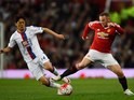 Lee Chung-yong and Wayne Rooney in action during the Premier League game between Manchester United and Crystal Palace on April 20, 2016