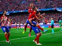 Atletico Madrid players celebrate after Saul Niguez gives them the lead against Bayern Munich in their Champions League semi-final on April 27, 2016