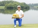  Soomin Lee of South Korea holds the trophy after winning the Shenzhen International at Genzon Golf Club on April 25, 2016
