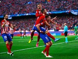 Atletico Madrid players celebrate after Saul Niguez gives them the lead against Bayern Munich in their Champions League semi-final on April 27, 2016