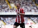Steven Davis celebrates doubling his tally during the Premier League game between Tottenham Hotspur and Southampton on May 8, 2016