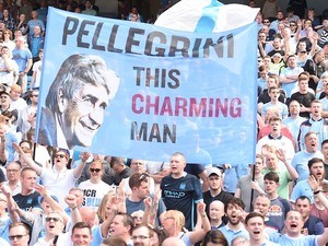 Manchester City fans hold up a sign for Manuel Pellegrini on May 8, 2016