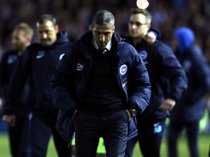 Brighton & Hove Albion manager Chris Hughton looks dejected after losing the Championship playoff semi-final first leg on May 13, 2016