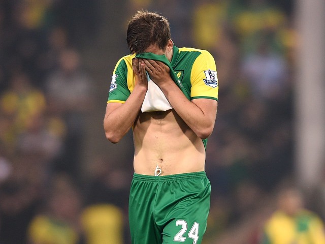 'Cryin' Ryan Bennett wipes away the tears after his Norwich City side are relegated from the Premier League despite a 4-2 win over Watford on May 11, 2016