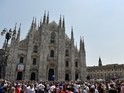 Atletico Madrid and Real Madrid fans gather outside the Piazza Duomo in Milan ahead of the Champions League final between the two sides on May 28, 2016