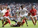 England scrum-half Ben Youngs manages to escape from Welsh players on his way to scoring a try at Twickenham on May 29, 2016