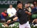 Kei Nishikori goes for a shot during his fourth round match with Richard Gasquet at the French Open on May 29, 2016