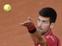 Novak Djokovic serves the ball to Lu Yen-Hsun during their men's first-round match at the French Open in Paris on May 24, 2016