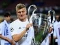 Toni Kroos poses with the trophy after the Champions League final between Real Madrid and Atletico Madrid on May 28, 2016