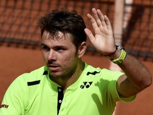 Stanislas Wawrinka celebrates after winning his second-round match against Taro Daniel at the French Open in Paris on May 25, 2016