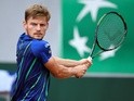David Goffin returns the ball to Ernests Gulbis at the French Open on June 1, 2016