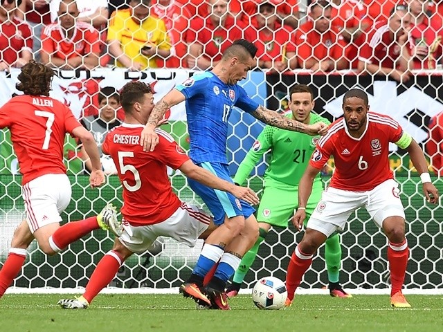 Marek Hamsik vies for the ball with James Chester and Ashley Williams during the Euro 2016 Group B match between Wales and Slovakia on June 11, 2016