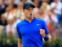 Kyle Edmund celebrates winning a point during his first-round match against Gilles Simon at Queen's on June 15, 2016