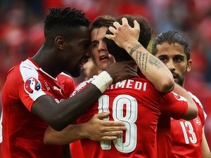 Admir Mehmedi is congratulated after scoring during the Euro 2016 Group A game between Romania and Switzerland on June 15, 2016