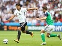Sami Khedira and Oliver Norwood in action during the Euro 2016 Group C match between Northern Ireland and Germany on June 21, 2016