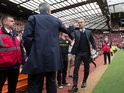 Manchester United manager Jose Mourinho and Manchester City boss Pep Guardiola shake hands before the derby at Old Trafford on September 10, 2016