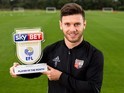 Scott Hogan poses with his Player of the Month award for September 2016