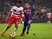 Barcelona's Paco Alcacer challenges Ruben Vezo of Granada during the La Liga clash at the Camp Nou on October 29, 2016